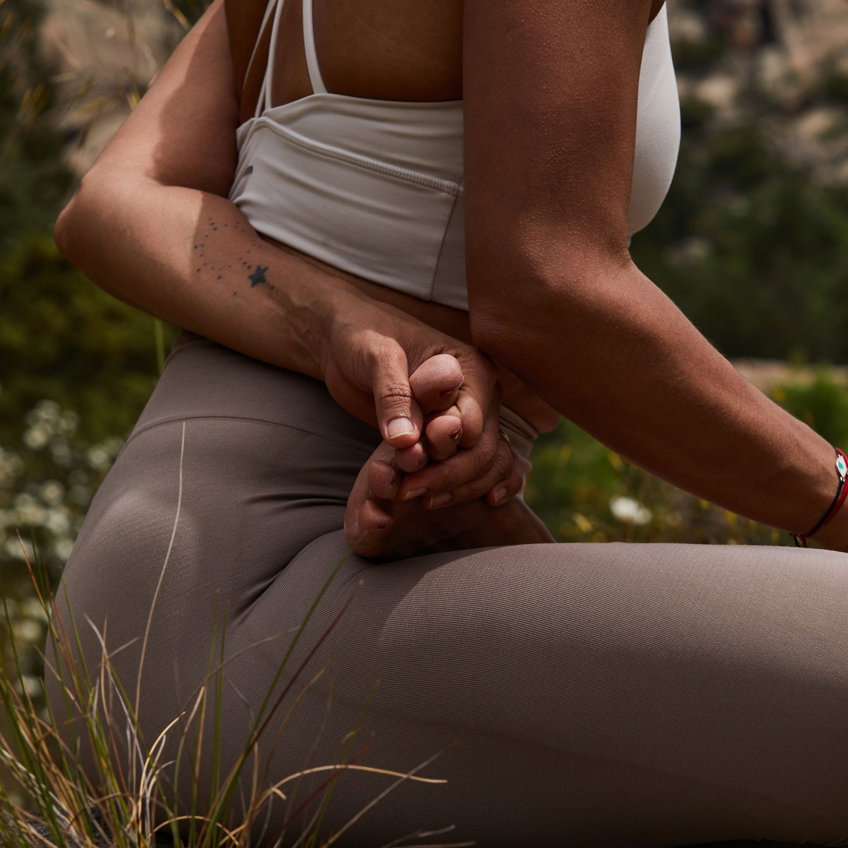 female doing yoga posture in nature for healing, wellness and restoration, East London